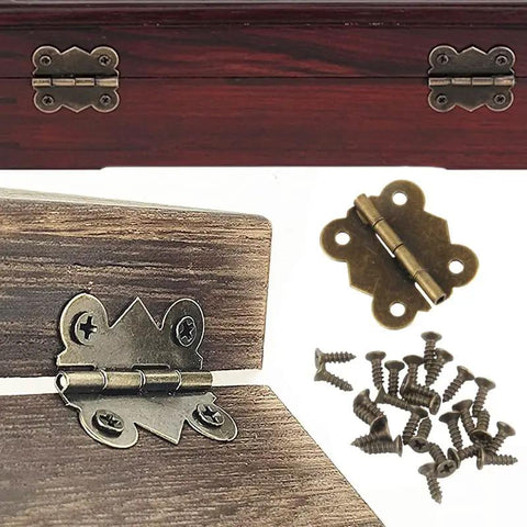 Sweet Antique Bronze Jewelry Box Hinges 12 Pack With Forty Eight Matching Screws, showing cast iron hinges and screws on wood.