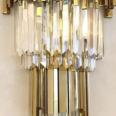 Sleek Led Wall Sconce Textured Crystal Glass Rod Shade Brushed Steel Frame close-up view showcasing shiny crystals and gold accents.