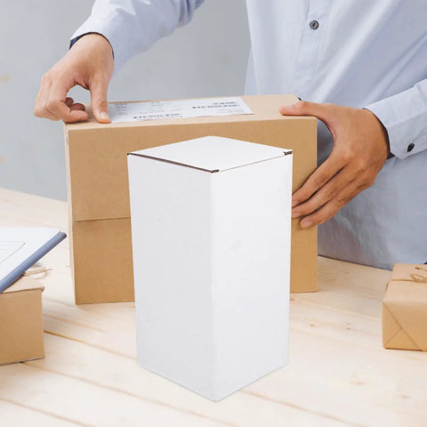10 Pack Beefy Heavy Duty Corrugated Cardboard Shipping Boxes 7x4x4 Inch Box Mailers for Shipping Packing and Storage shown in use