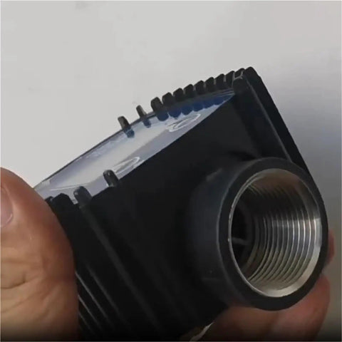 Close-up of Real Time Flow Meter Sensor For Fuel And Water With K24 Gear, showing threaded connector and part of the LCD readout.