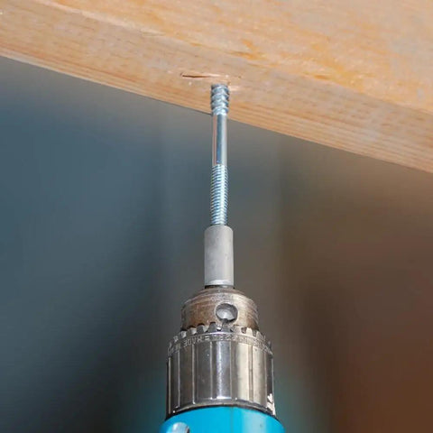 Impact Driver Hanger Bolt Driver Bit Three Eighths Inch By Sixteen Thread For Quick Release installed on wooden board