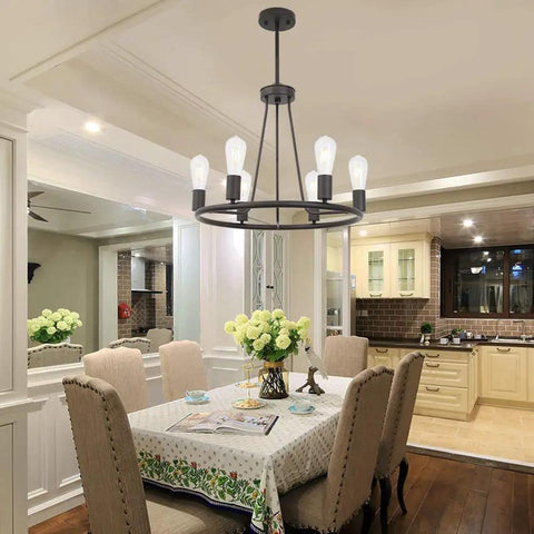 Rustic Farmhouse Round Pendant Lighting 6-Light Chandelier In Oil-Rubbed Bronze hanging above a dining table in cozy setting.