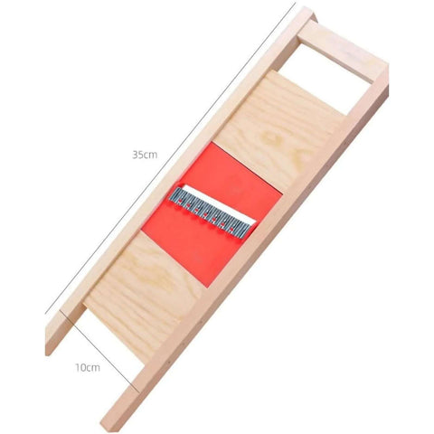 Angled view of Wave Waffle Crinkle Cutter Set with stainless steel blade and red insert in a wooden frame