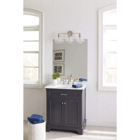 Three Light Coastal Vanity Light With Clear Glass Shades In Polished Nickel Finish for modern beachy bathroom setup above sink