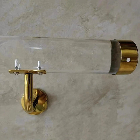 Clear Acrylic Stair Handrail With Gold Wall Brackets And Firm Grip Built Tough For Custom Indoor Banisters Rock Solid Heavy Duty Wall Mount Support Adjustable Lengths For Home Reno close-up of mounting bracket and grip