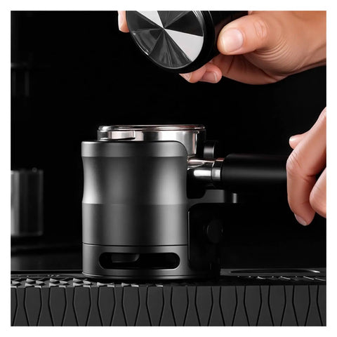 Close-up of 58mm Adjustable Portafilter Holder And Espresso Tamping Station with silicone mat, steady setup for espresso.