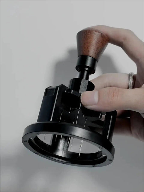Premium Game Changer 58Mm Espresso Coffee Distributor With Magnetic Base and Precision Rotary Needles in hand.