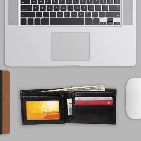 Rugged RFID Leather Bifold Chain Wallet For Men In Pebbled Black on desk with cards and bills visible