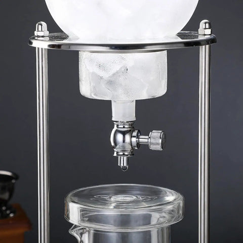 Premium Cold Brew Drip Tower With Adjustable Flow Control Borosilicate Glass Carafe showcasing ice in holder and drip valve.