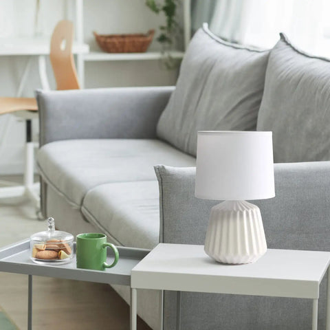 Petite Pleated Ceramic Table Lamp With Off White Fabric Shade 5 Ft Cord 40W Equivalent Type B Bulb Not Included Classic English Style Accent Light For Bedroom Or Living Room Cozy Glow on white table next to green mug
