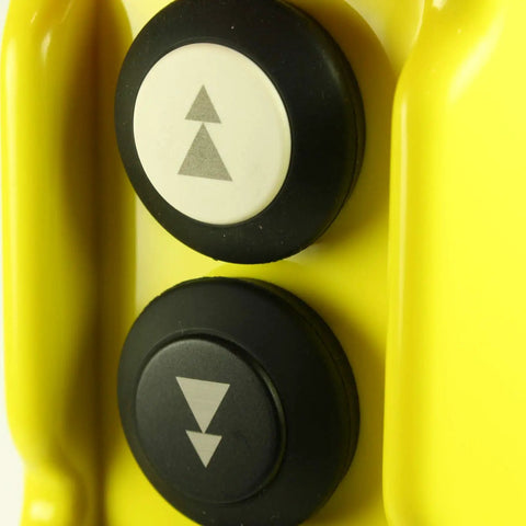 Close-up of two buttons on the Five Button Crane Pendant Station With Emergency Stop For Overhead Cranes, yellow housing, up and down arrows.