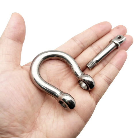 Beefy Heavy Duty Half Inch Screw Pin Anchor Shackle Set 304 Stainless Steel 12mm Bolt Pin Shackles For Chains And Wire Rope Rugged And Corrosion And Moisture Resistant Pack Of 2 shown in hand for size reference