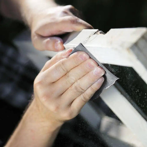 18 Piece Wet And Dry Sandpaper Set Pro Grade 3000 5000 7000 Grit being used on wood