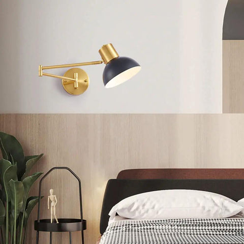 Badass Industrial Metal Swing Arm Wall Sconce With Rock Solid Adjustable Dome Shade And E27 Socket Hella Sturdy For Bedroom Reading Vibes And Slick Black Brass Finish Modern Wall Lamp, mounted next to a bed.