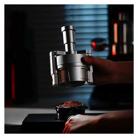 Lock In That Perfect Shot With This 58Mm Magnetic Wdt Tool in stainless steel, equipped over coffee grounds for even distribution.