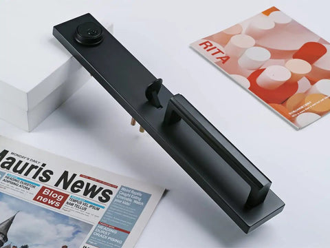 Iron Black Front Double Door Handleset With Keyed Entry displayed on table with magazines