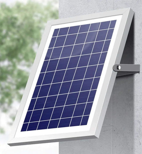 Hella Bright 200 Watt Solar Flood Light With Integrated Remote And Badass IP67 Waterproof Shell solar panel mounted on wall.