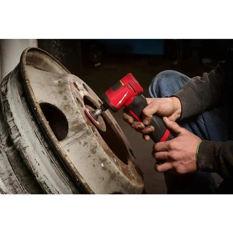 Pro Grade Heavy Hitter Brushless Right Angle Die Grinder With Four Speed Settings And Variable Trigger Plus Built In LED Light Compact M12 Platform compatible, used for polishing a metal wheel.