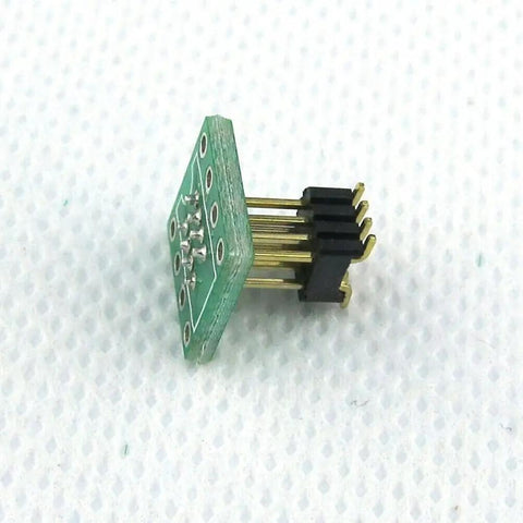 DIP8 To SOP8 Adapter For SMT SOIC8 Socket 8 Pin To 8 Pin Converter PCB showing pins and soldering points on white background