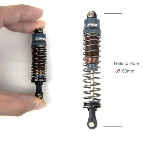 Close-up of 80mm RC Oil Filled Shock Absorber Kit for 1/10 scale crawlers, showing CNC aluminum body and threaded preload, grey.