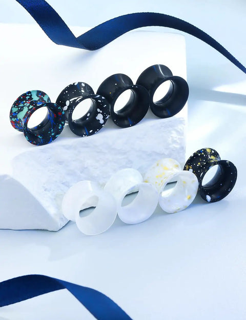 Assorted black and white silicone ear gauges with marble patterns on display. Silicone Ear Gauges Tunnels Plugs For Ears 10mm 00G.