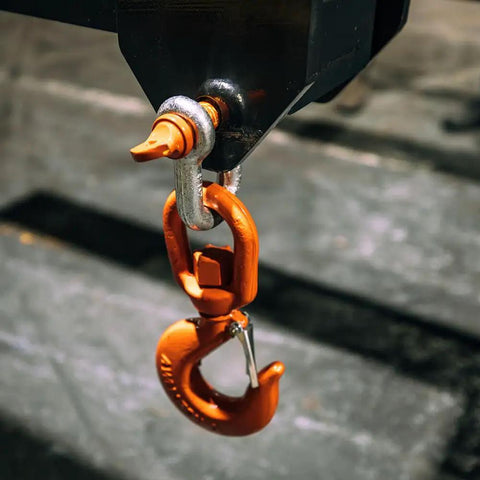 Close-up of an orange hook attachment for Top Shelf Adjustable Fork Spreader For Forklift And Telehandler. Expands From 83 To 119 Inches Wide.