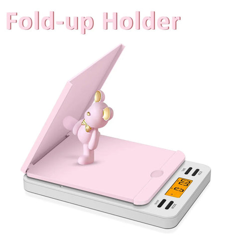 Rock Solid Digital Postal Scale For Heavy Duty Package Shipping With pink fold-up holder and bear figurine for steady tracking.