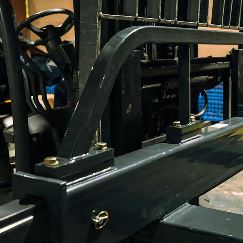 Top Shelf Adjustable Fork Spreader For Forklift And Telehandler close-up view of mounting hardware and support beams.