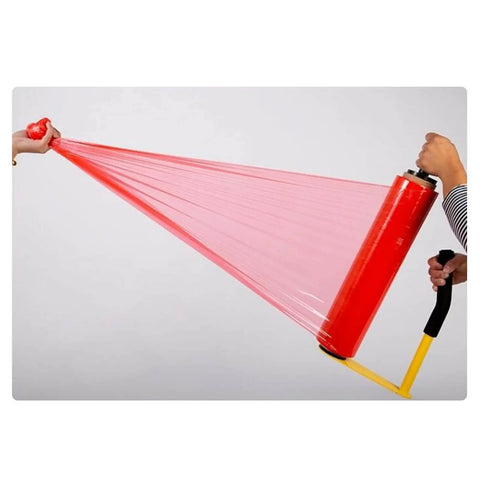 Solid Workhorse Handheld Stretch Film Dispenser With Adjustable Roll Height And Quick Tension Dial for pallet wrapping in use, showing red stretch film.