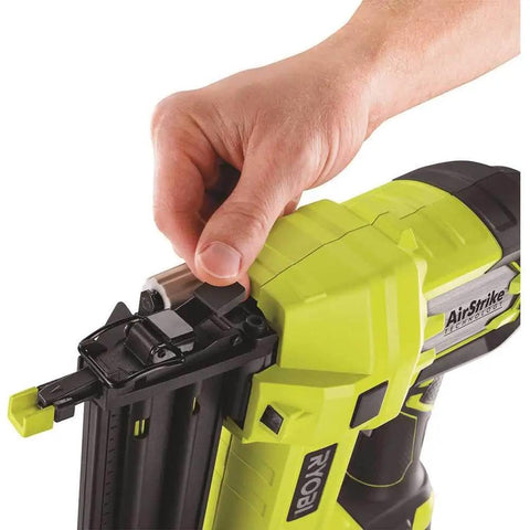 Hand adjusting Airstrike 18V Cordless Brad Nailer P320 One Plus Lithium Powered, showing depth dial and nail chamber.