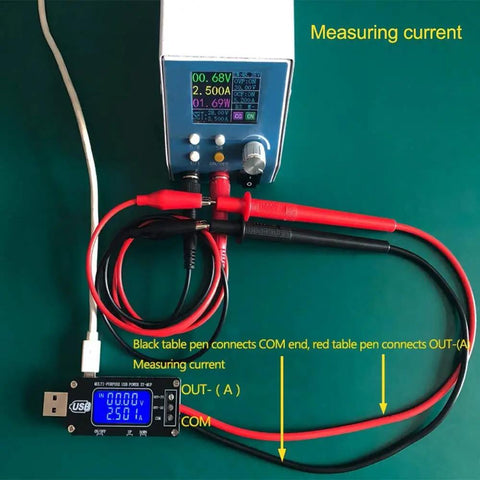 USB DC-DC Step Up Down GoTo Power Regulator Module 3.5V-12V To 1-24V 2-3W with display and connecting cables on green surface