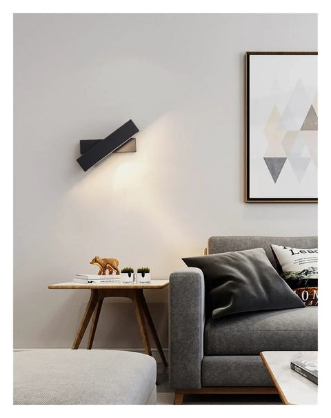 Elevate Your Home Vibe With This Sleek Black Metal Swivel Wall Sconce LED Lighting for Bedroom Living Room and Hallways, showcasing a focused light.