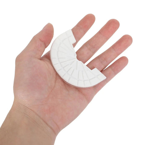 Hand holding a white Premium Rubber Sole Protector for Sneakers and Boots with 4mm Anti Scuff Heel Pads.