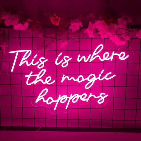 Where The Magic Happens Neon Sign Wall Decor 23 Inch LED Neon Light for Bedroom Bar Party with pink glow on grid wall