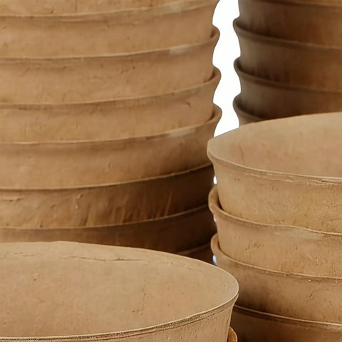 Stack of breathable paper pulp nursery pots for seedlings and direct planting, ideal for yard balcony garden beds and containers