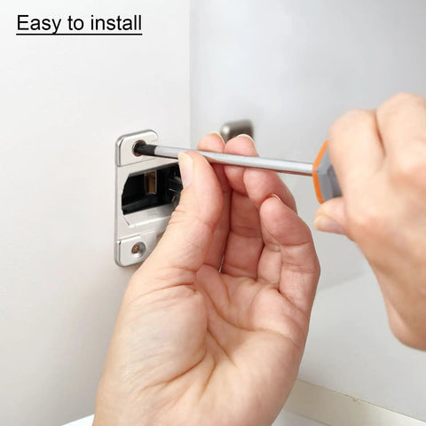 Installing Heavy Duty Self Closing Cabinet Hinges Eight Pack For Kitchen And Closet Doors with a screwdriver through a silver hinge.