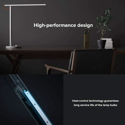 Lit Smart LED Desk Lamp With Remote Control on a dark office desk with plant, showcasing sleek, award-winning design.