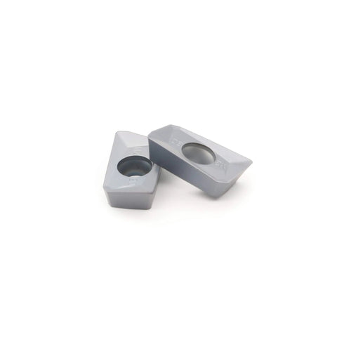 Two gray APMT1604PDER-M2 carbide inserts with central holes for CNC milling tools