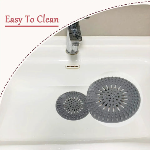 Banish Clogged Drains Fast With This Flexible Drain Strainer Set, Solid Snag Catcher Hair Filter, Stretchy Rubber Sink Protector, Easy Splash Multi Color Bath Nets 6 Pack shown in gray, positioned in sink for easy cleaning.