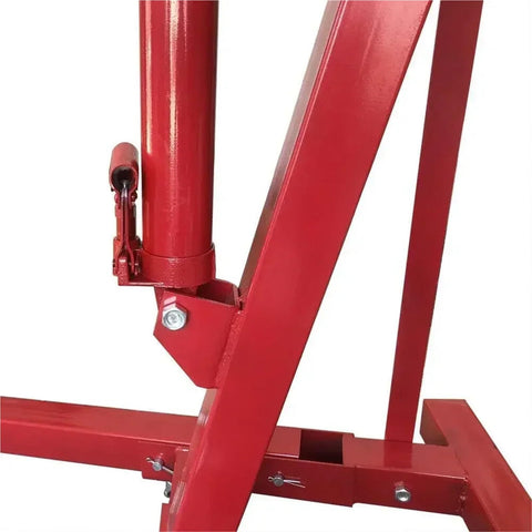Close-up of Heavy Duty Folding Hydraulic Engine Hoist 2 Ton 4000 Lb Capacity Shop Crane structure, highlighting the red frame and hydraulic components.