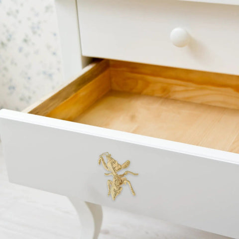 Antique Mantis Cabinet Pull Handles Insect Drawer Knobs on white dresser with golden brass finish in vintage style