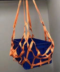 Heavy Duty Cargo Lifting Net 1.5x1.5m Flat Sling Hoist Net holding blue box, 300Kg capacity, orange polyester straps