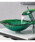 Slick Tempered Glass Vessel Sink Lotus Leaf Countertop Basin featuring smooth waterfall flow in a vibrant green color.
