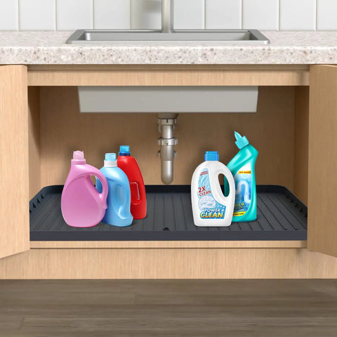 34 Inch By 22 Inch Under Sink Mat Waterproof Silicone Drip Tray With Drain Hole Cabinet Protector holding bottles under sink.