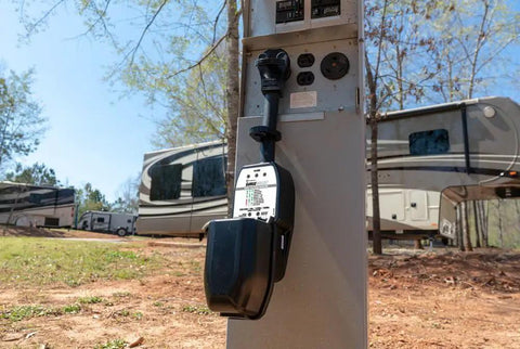 Portable 50A Surge Guard Power Protector With LED Fault Readout installed at RV campground