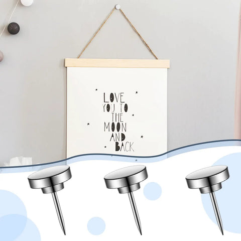 Built Tough Silver Metal Push Pins And Straight Shooting Thumb Tacks For Bulletin Boards Smooth Wall Mounting Heavy Duty Picture Hangers Compact Go To Office Supplies 30 Piece Set holding a poster.