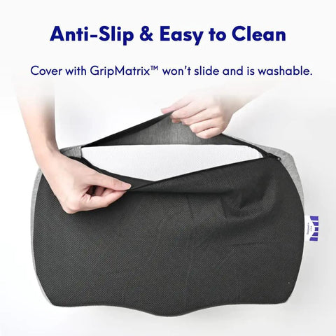 Hands opening cover of ergonomic under desk foot rest with Massage Ridge design and memory foam pillow, showing anti-slip feature.