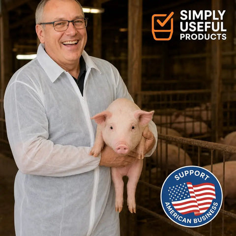 Kick Up Dust Without Breaking A Sweat With These Super Lightweight Disposable Coveralls And Breathable Paint Suit Solid Crawlspace Gear That Stays Cool Handles Messes Like A Champ All Day Long, man in disposable coveralls holding a pig.