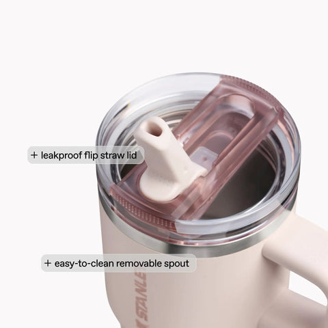 Close-up of the leakproof flip straw lid on the Solid Double Wall Vacuum Insulated Flip Straw Travel Tumbler With Secure Leakproof Lid Keeps Drinks Ice Cold All Day Long Rose Quartz Thirty Ounce Portable Cup For Gym Hiking And Daily Grind.