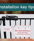Close-up of installation tips and zip tie on Extra Wide Baby Gate For Doorways And Stairs, Pressure Mounted Black Metal Walk Through Design